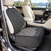 Charcoal quilted dog cover fitted to an empty front car seat