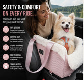 Small white dog in a pink pet car seat with shoulder strap