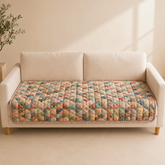 Pastel patchwork dog cover on an empty sofa