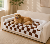 Golden Retriever on a brown and cream checked sofa cover