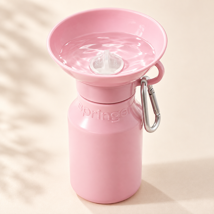 Pink dog water bottle with integrated drinking bowl