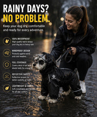Owner and dark-coated dog wearing a black raincoat outdoors